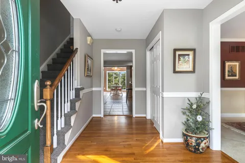a view of an entryway with wooden floor