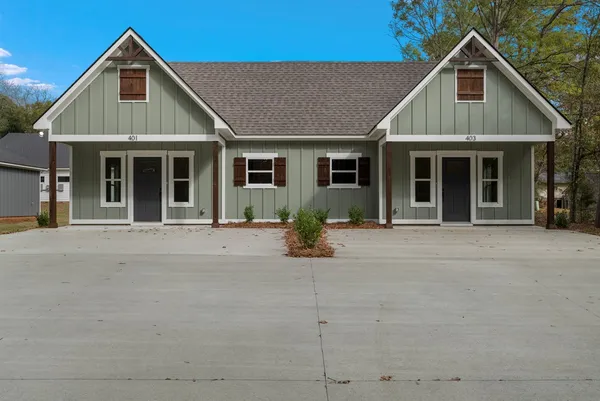 a front view of a house with garage