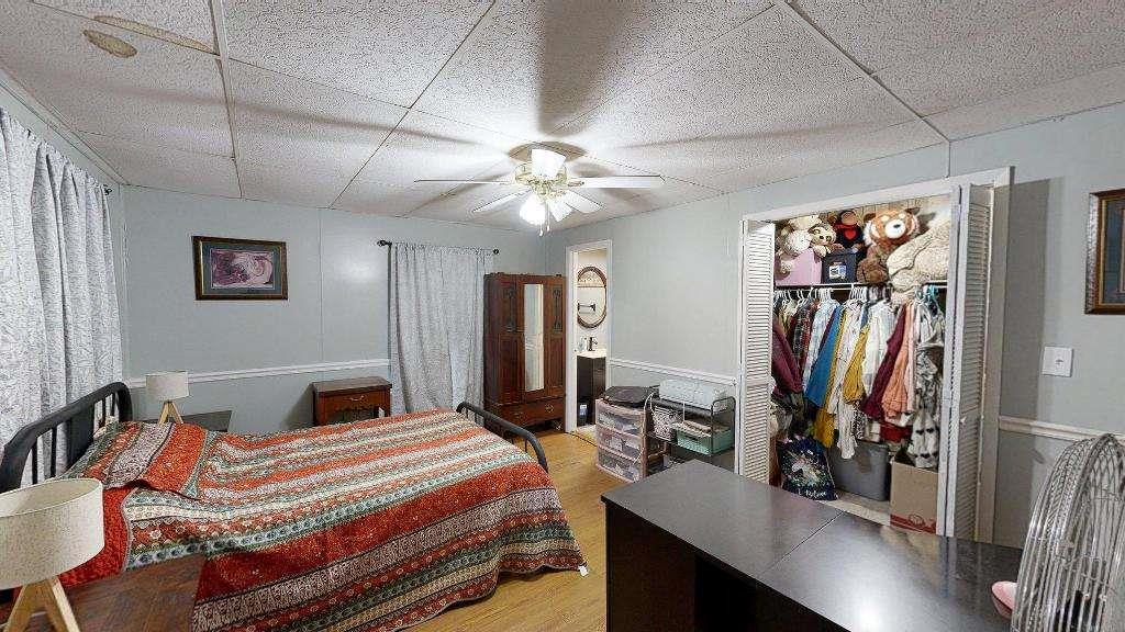 15 Aragon Road Aragon, GA 30104 - Photo 13 of 33 a bedroom with a bed and a chandelier