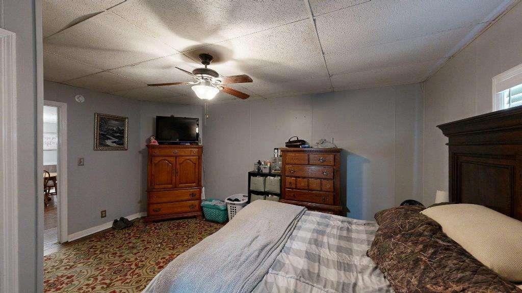 15 Aragon Road Aragon, GA 30104 - Photo 17 of 33 a bedroom with a bed and a television