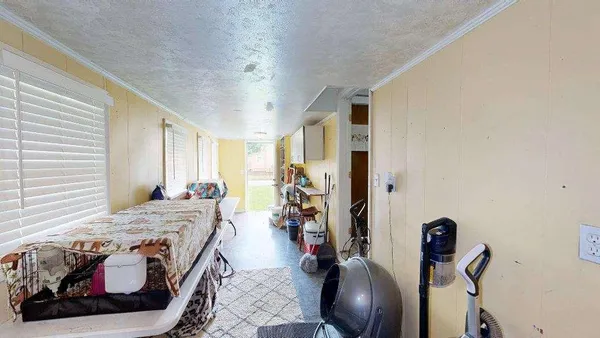 a bed room with furniture and a window
