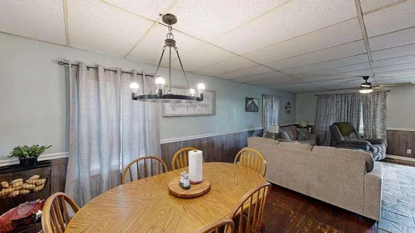 a kitchen with a stove a sink and cabinets