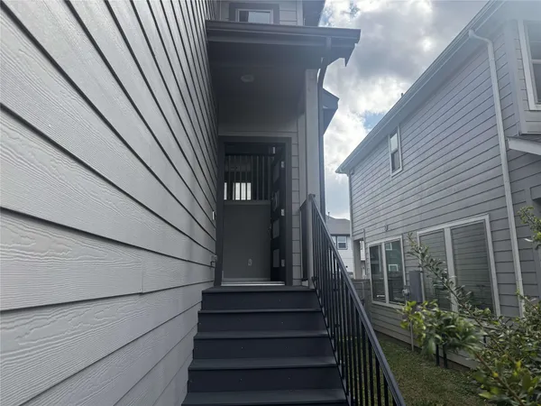 a view of stairs and an empty room