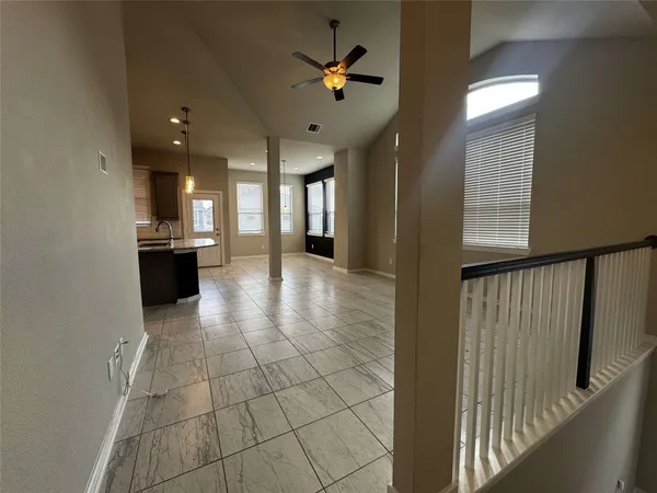 a kitchen with kitchen island granite countertop a sink counter top space appliances and cabinets