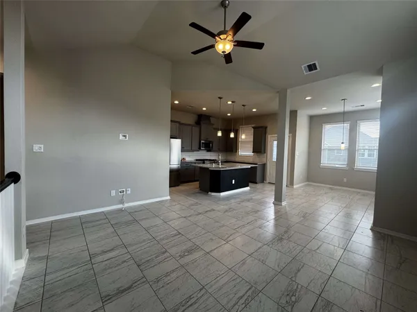 a stove top oven sitting inside of a kitchen
