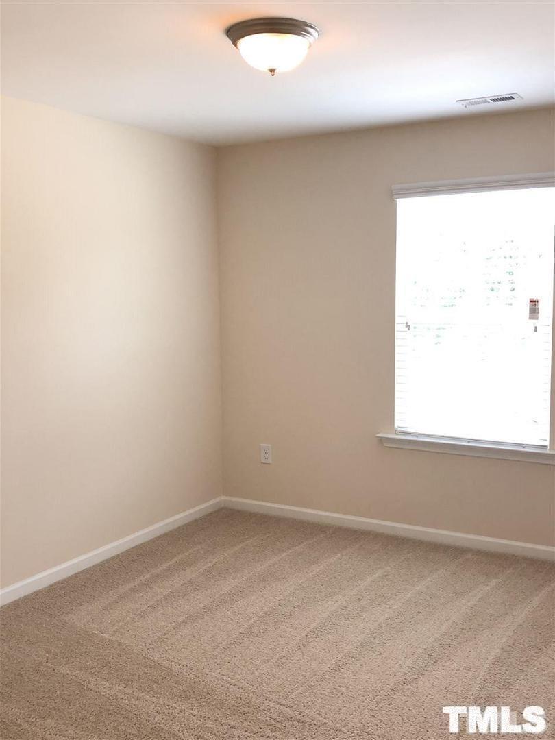 2555 Rambling Creek Road Apex, NC 27523 - Photo 13 of 23 a view of an empty room and a window