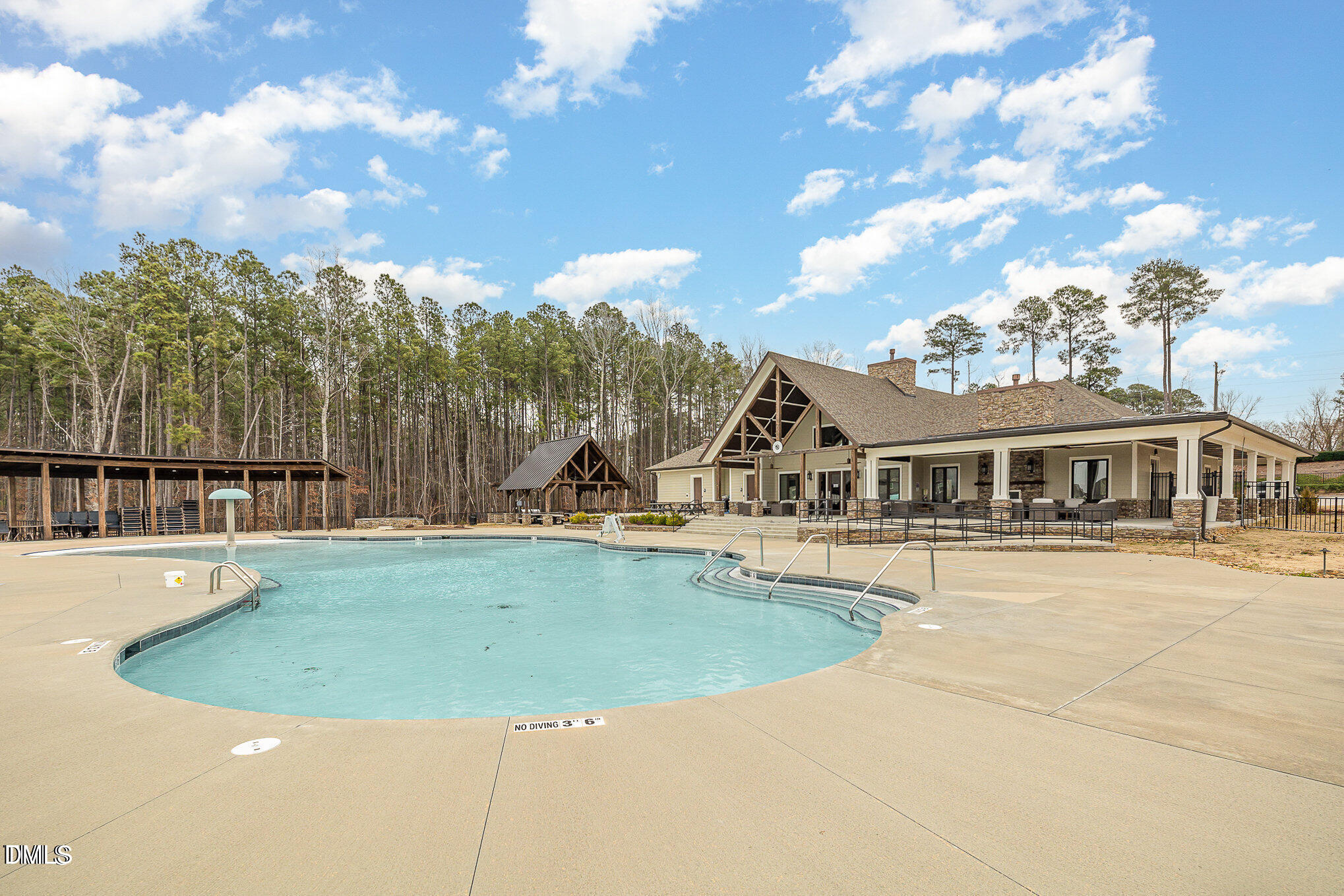 2555 Rambling Creek Road Apex, NC 27523 - Photo 23 of 23 a view of a house with swimming pool and sitting area