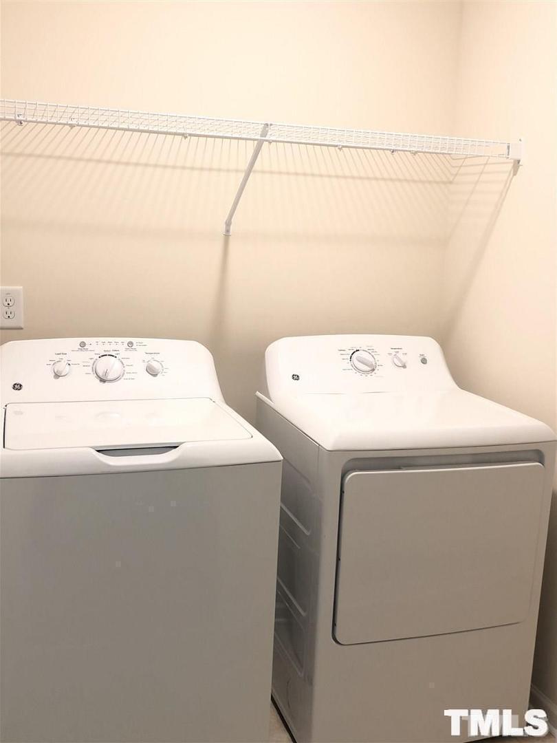 2555 Rambling Creek Road Apex, NC 27523 - Photo 8 of 23 a utility room with dryer and washer