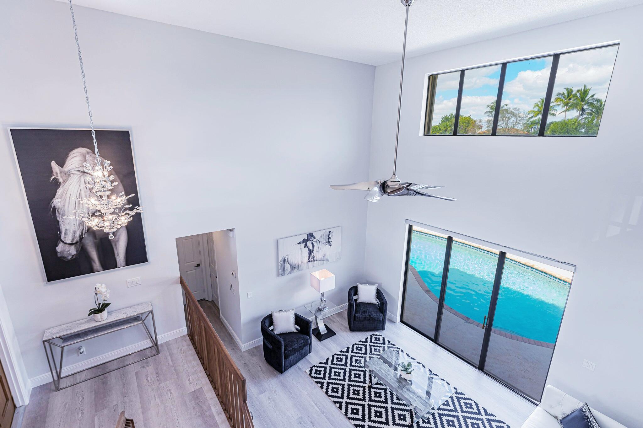 12715 Kingsway Road Wellington, FL 33414 - Photo 15 of 36 a bedroom with furniture and a window