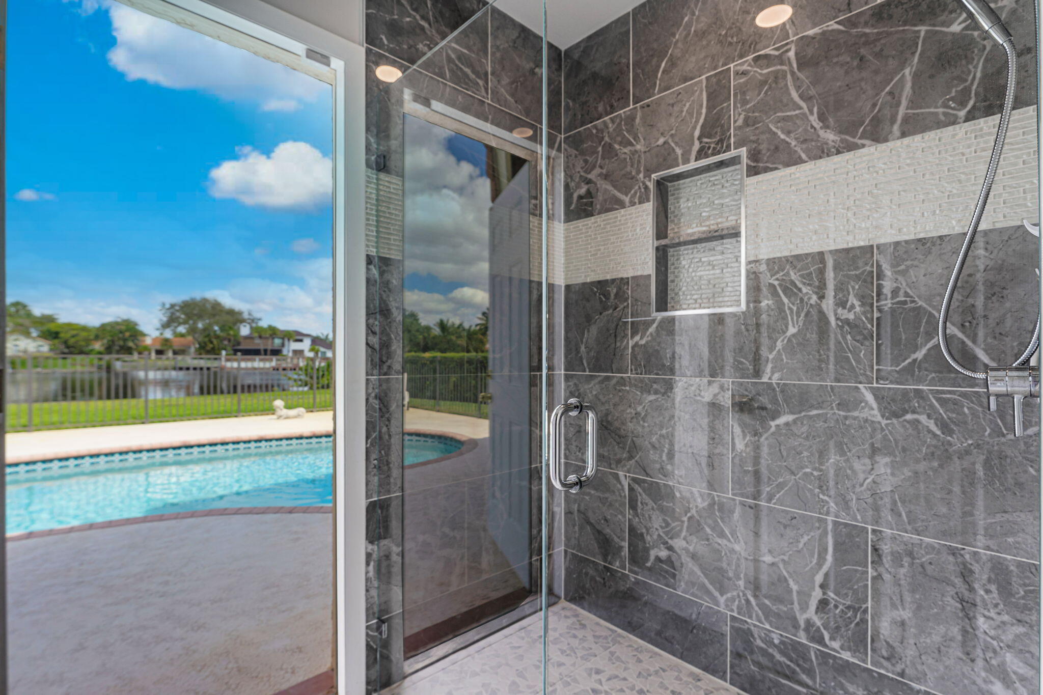 12715 Kingsway Road Wellington, FL 33414 - Photo 18 of 36 a view of a bathroom with a tub and window