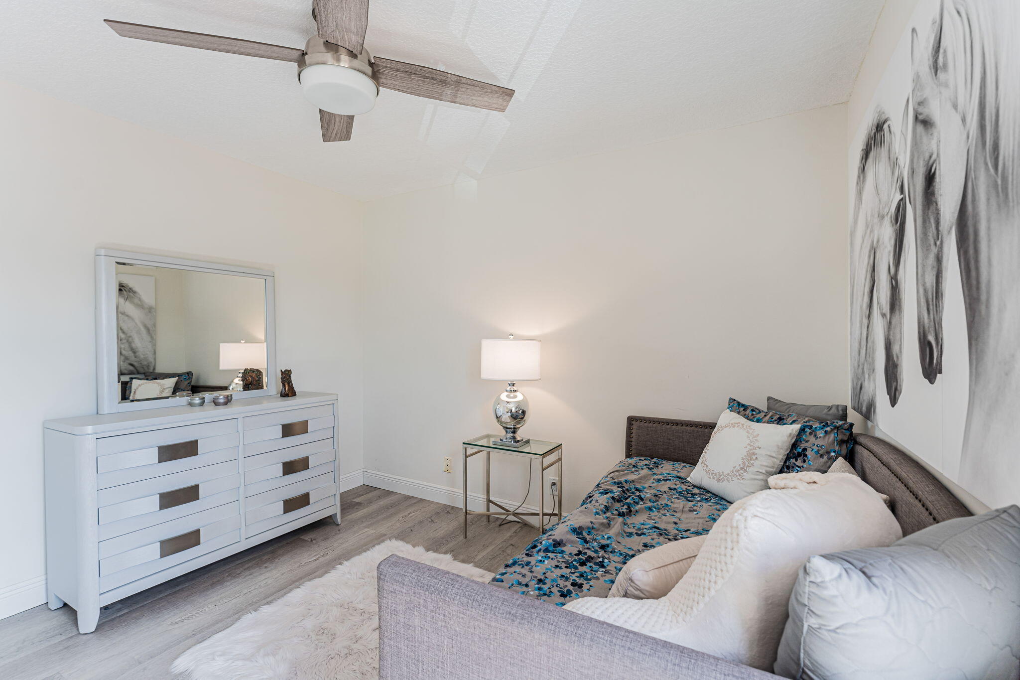 12715 Kingsway Road Wellington, FL 33414 - Photo 26 of 36 a living room with furniture and a flat screen tv