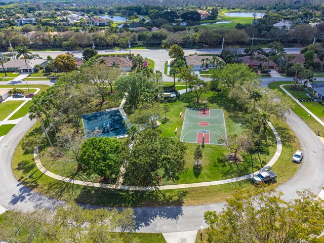 an aerial view of residential house with outdoor space and swimming pool