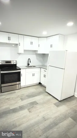 a view of kitchen with cabinets and stainless steel appliances