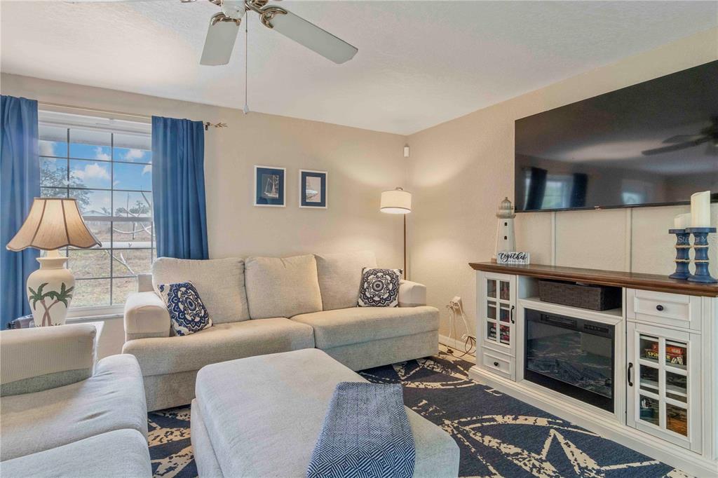333 Hile Lane Punta Gorda, FL 33982 - Photo 12 of 72 a living room with furniture and a fireplace