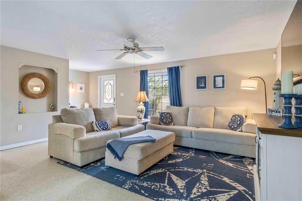 333 Hile Lane Punta Gorda, FL 33982 - Photo 19 of 72 a living room with furniture and a large mirror