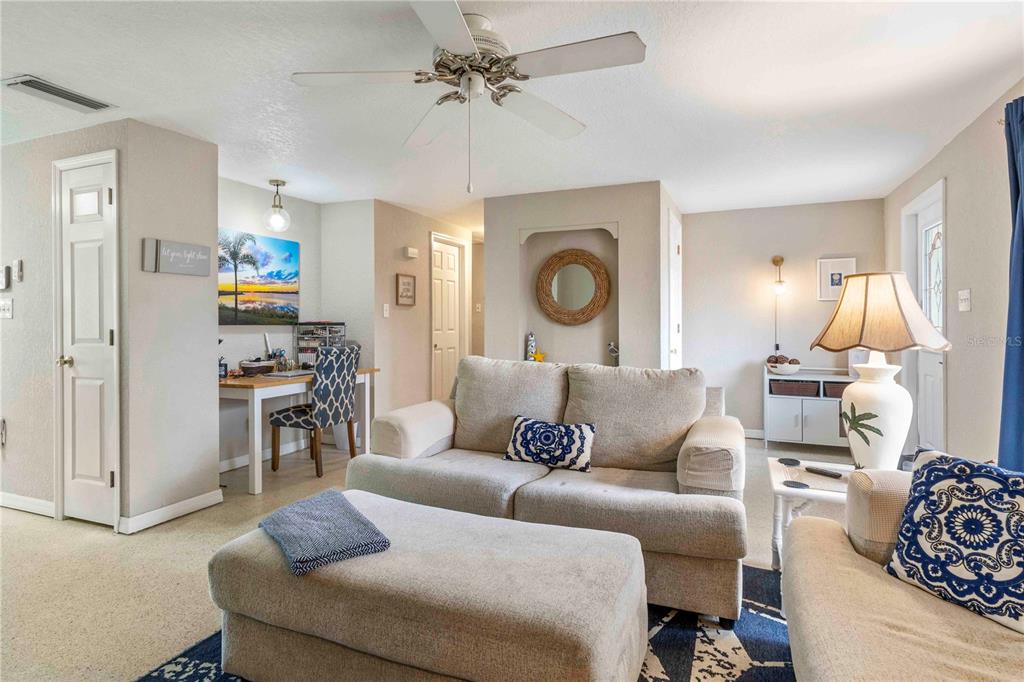 333 Hile Lane Punta Gorda, FL 33982 - Photo 20 of 72 a living room with furniture and a clock