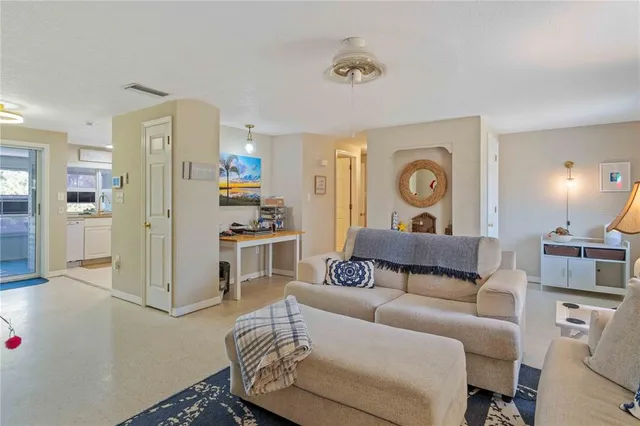 a living room with furniture and a table