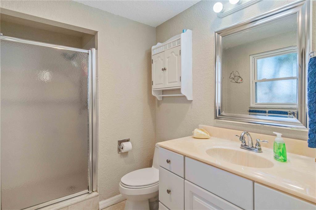 333 Hile Lane Punta Gorda, FL 33982 - Photo 38 of 72 a bathroom with a granite countertop sink a toilet and a mirror