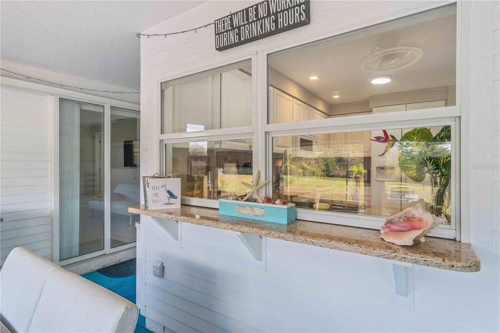 333 Hile Lane Punta Gorda, FL 33982 - Photo 50 of 72 a living room with a large window and furniture