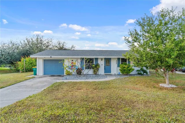a living room with furniture a rug and a chandelier