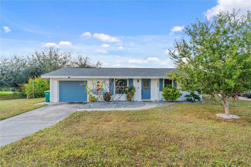 333 Hile Lane Punta Gorda, FL 33982 - Photo 8 of 72 a view of a house with a yard and large tree
