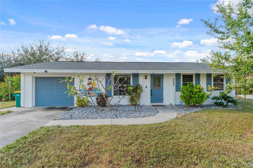 333 Hile Lane Punta Gorda, FL 33982 - Photo 9 of 72 a front view of house with yard seating and green space