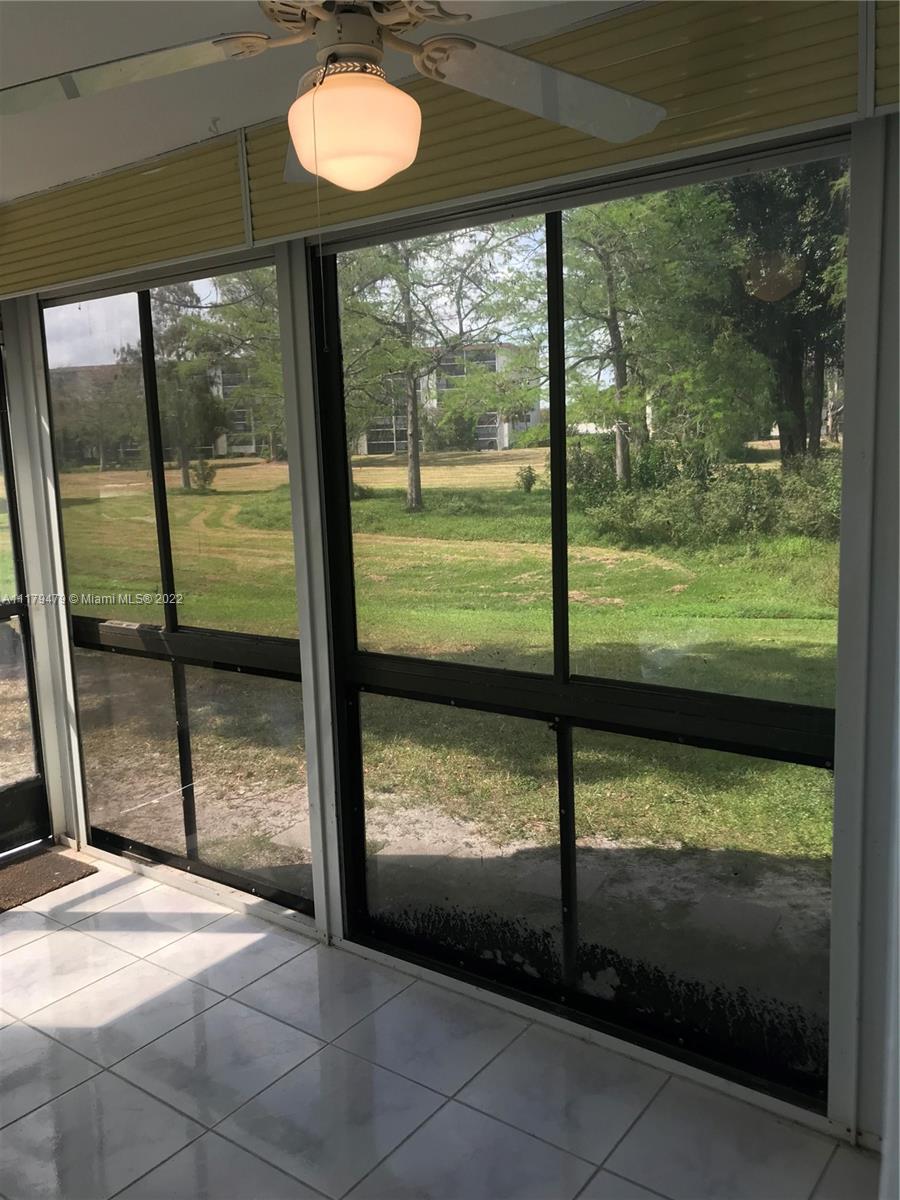4172 Inverrary Drive, Unit 101 Lauderhill, FL 33319 - Photo 11 of 32 a view of a room with a bed and wooden floor