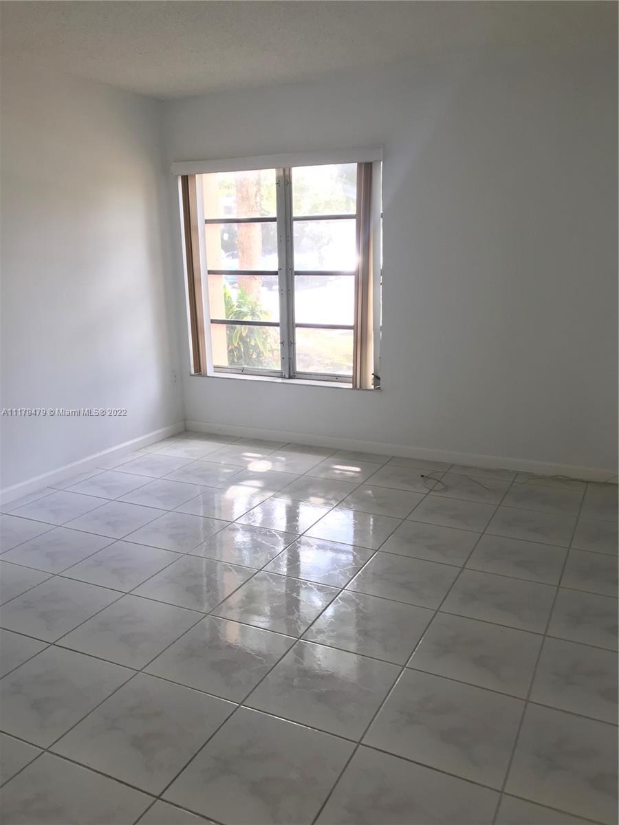 4172 Inverrary Drive, Unit 101 Lauderhill, FL 33319 - Photo 18 of 32 a view of an empty room with a window