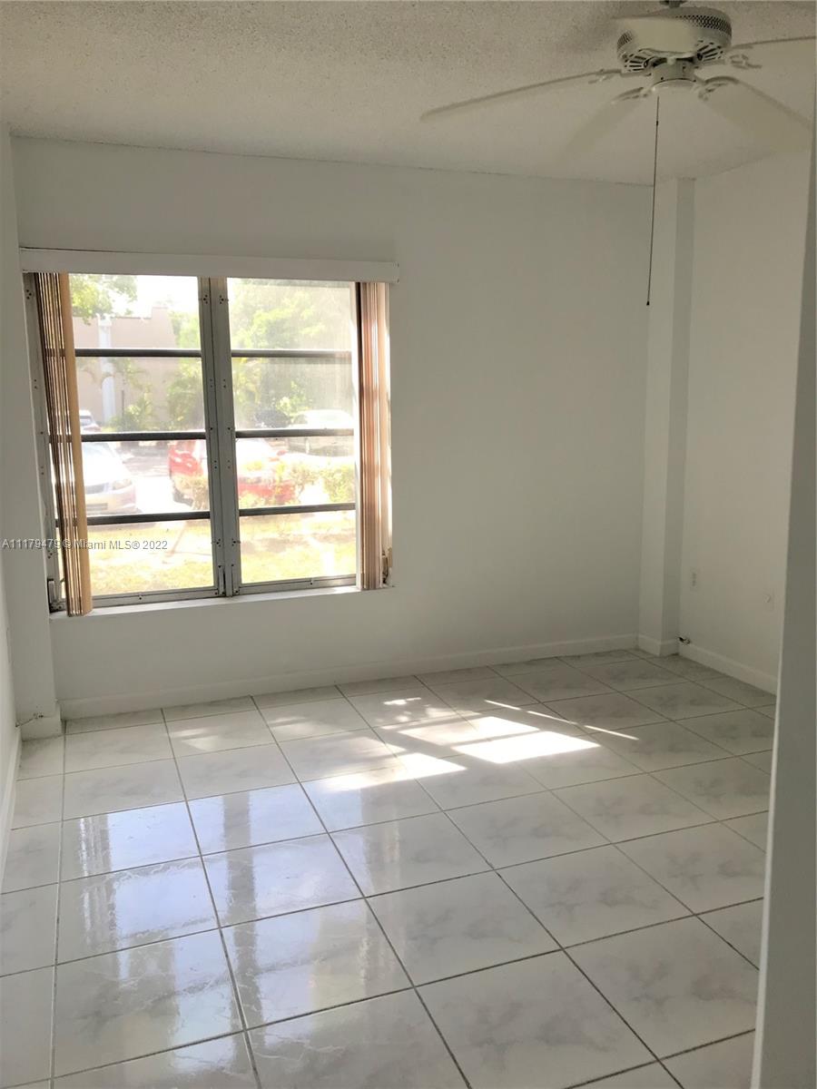 4172 Inverrary Drive, Unit 101 Lauderhill, FL 33319 - Photo 19 of 32 a view of an empty room with a window