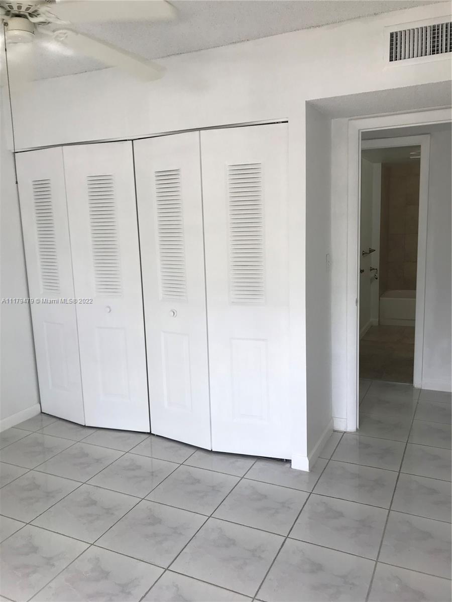 4172 Inverrary Drive, Unit 101 Lauderhill, FL 33319 - Photo 21 of 32 a view of a closet area with hardwood