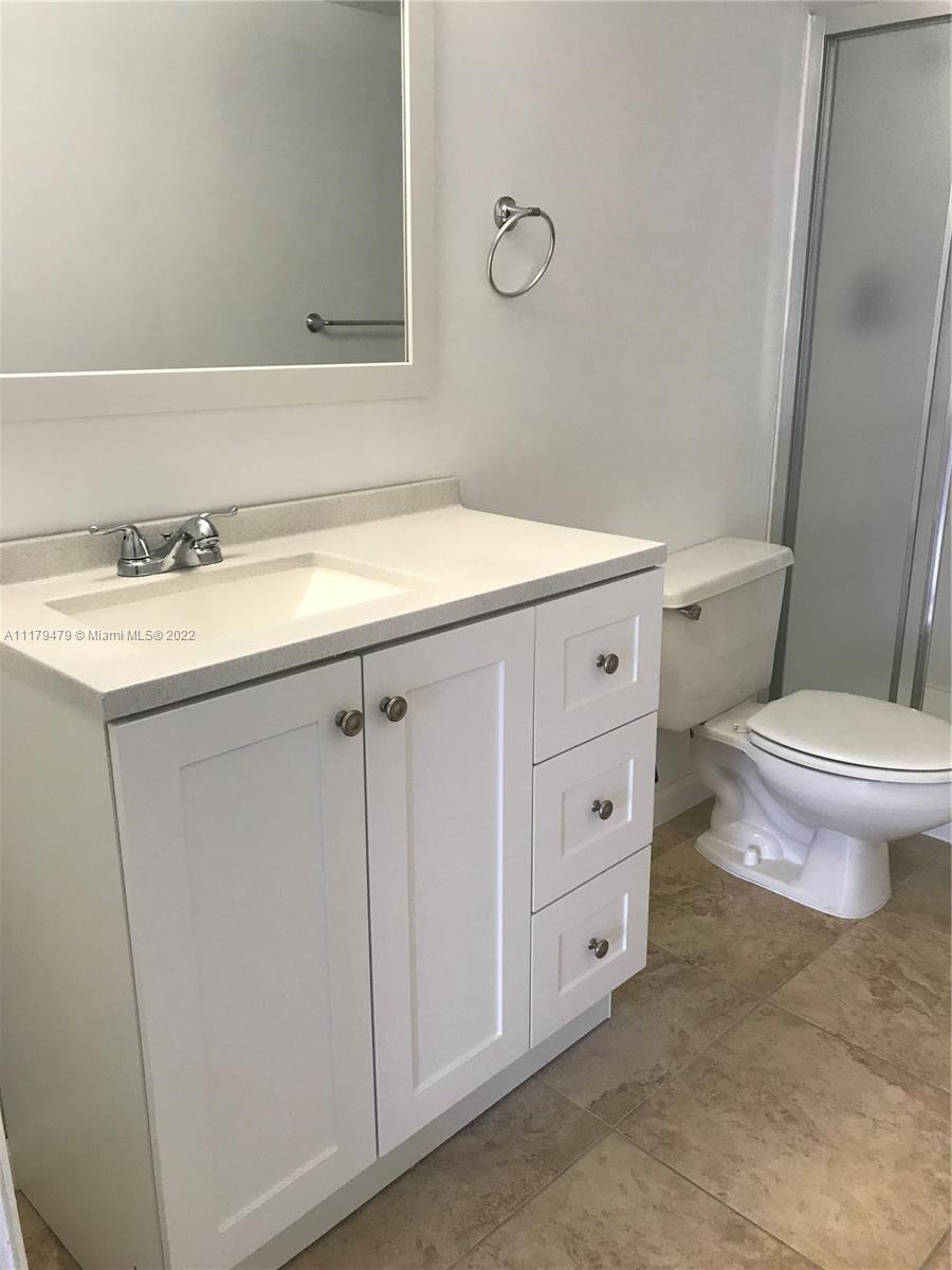 4172 Inverrary Drive, Unit 101 Lauderhill, FL 33319 - Photo 25 of 32 a bathroom with a sink and a toilet