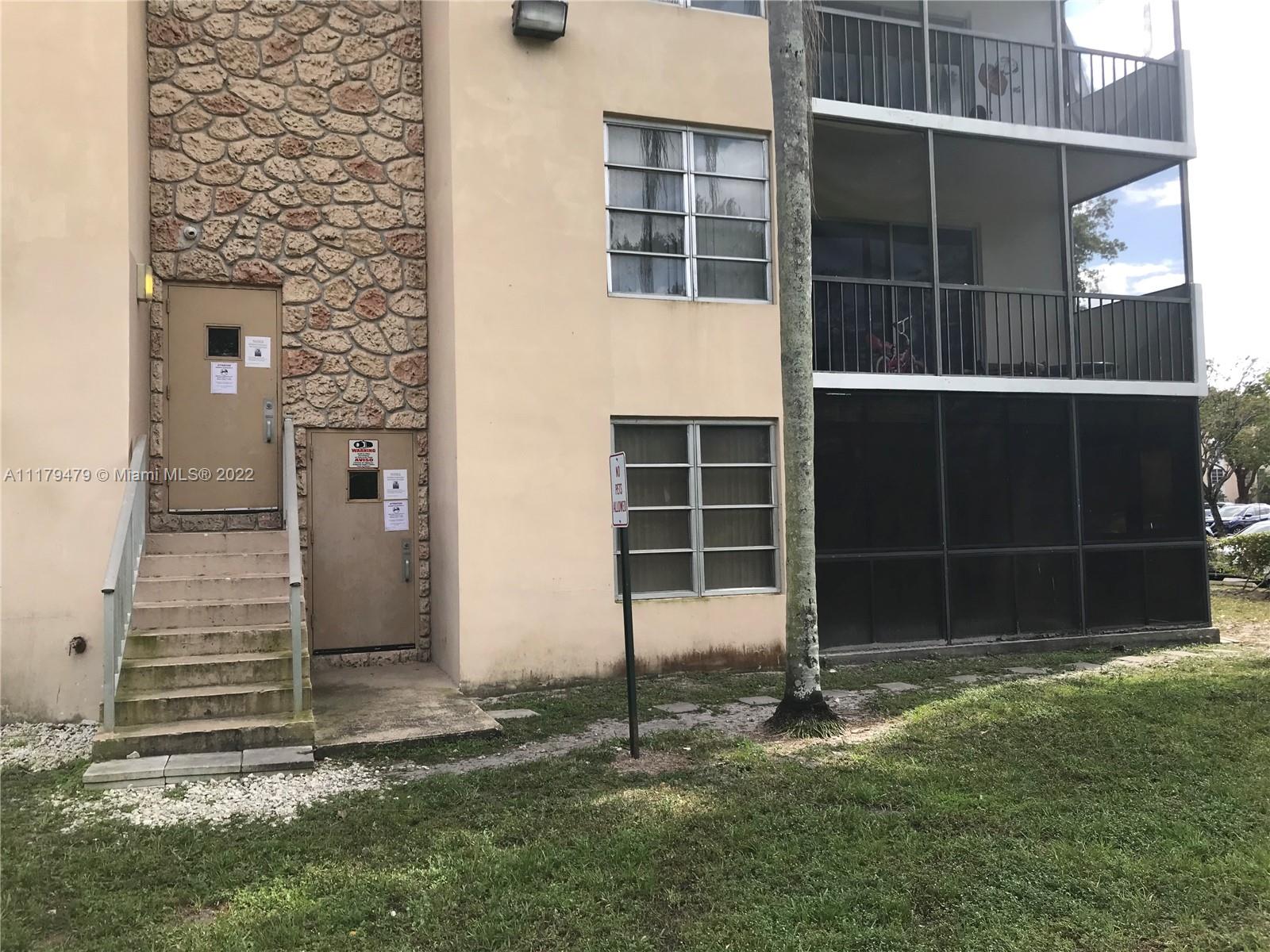 4172 Inverrary Drive, Unit 101 Lauderhill, FL 33319 - Photo 29 of 32 a backyard of house with a window