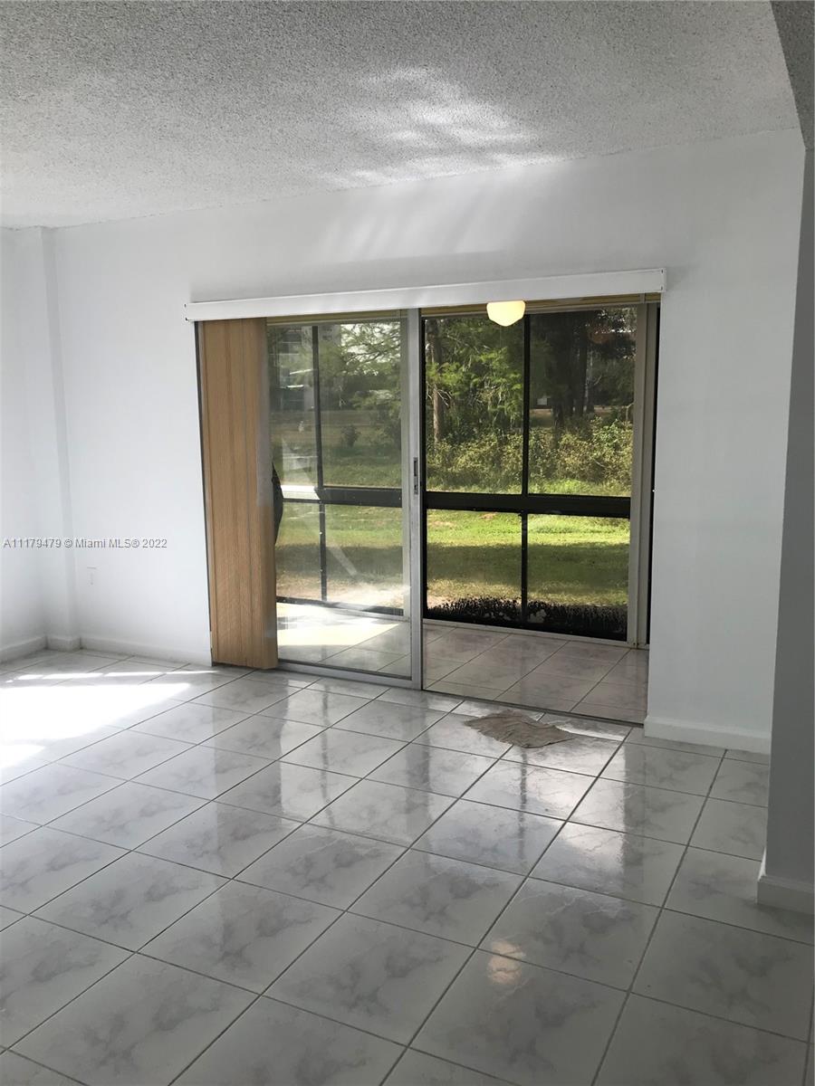 4172 Inverrary Drive, Unit 101 Lauderhill, FL 33319 - Photo 3 of 32 a view of a room with a large window