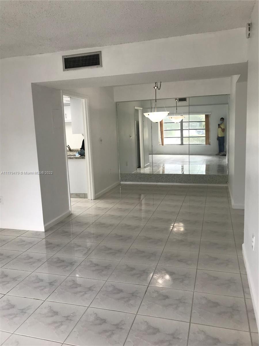 4172 Inverrary Drive, Unit 101 Lauderhill, FL 33319 - Photo 5 of 32 a view of kitchen with refrigerator and window