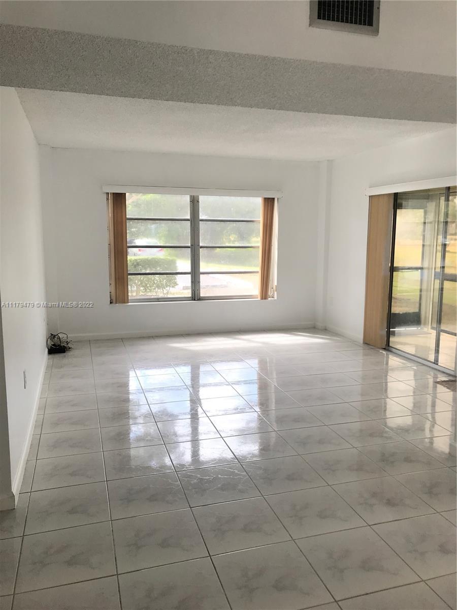 4172 Inverrary Drive, Unit 101 Lauderhill, FL 33319 - Photo 6 of 32 a view of an empty room and window
