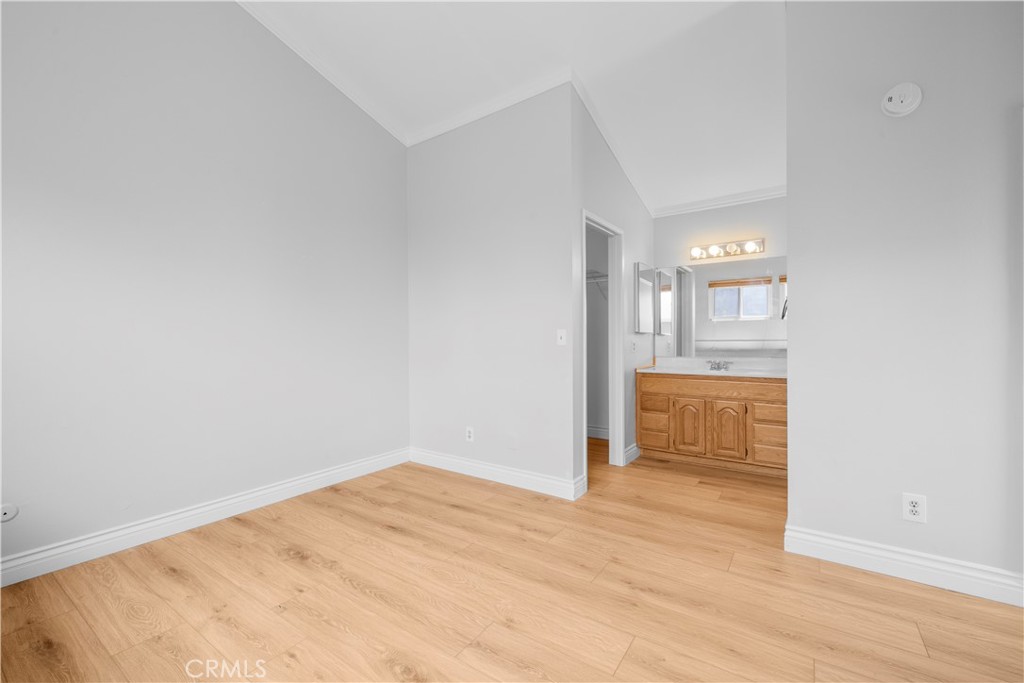2700 North Brea Boulevard, Unit 24 Fullerton, CA 92835 - Photo 19 of 27 wooden floor in an empty room