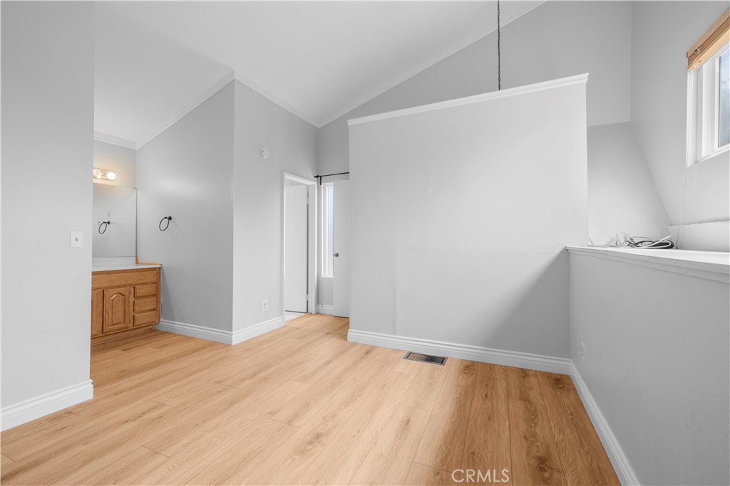 2700 North Brea Boulevard, Unit 24 Fullerton, CA 92835 - Photo 21 of 27 a view of a room with wooden floor and cabinet