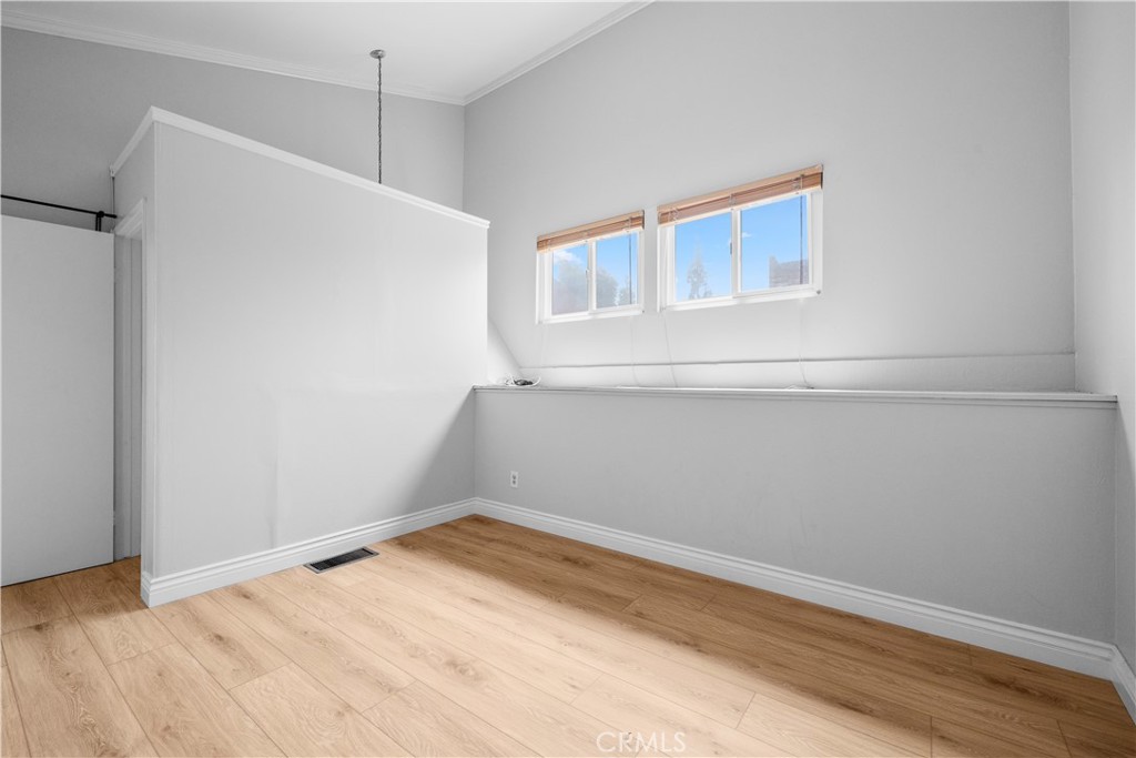2700 North Brea Boulevard, Unit 24 Fullerton, CA 92835 - Photo 22 of 27 a view of empty room with wooden floor