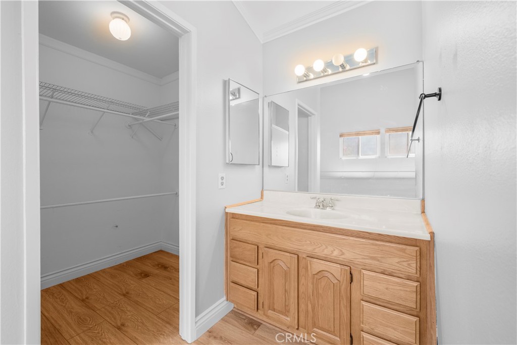 2700 North Brea Boulevard, Unit 24 Fullerton, CA 92835 - Photo 23 of 27 a bathroom with a sink a vanity and a mirror