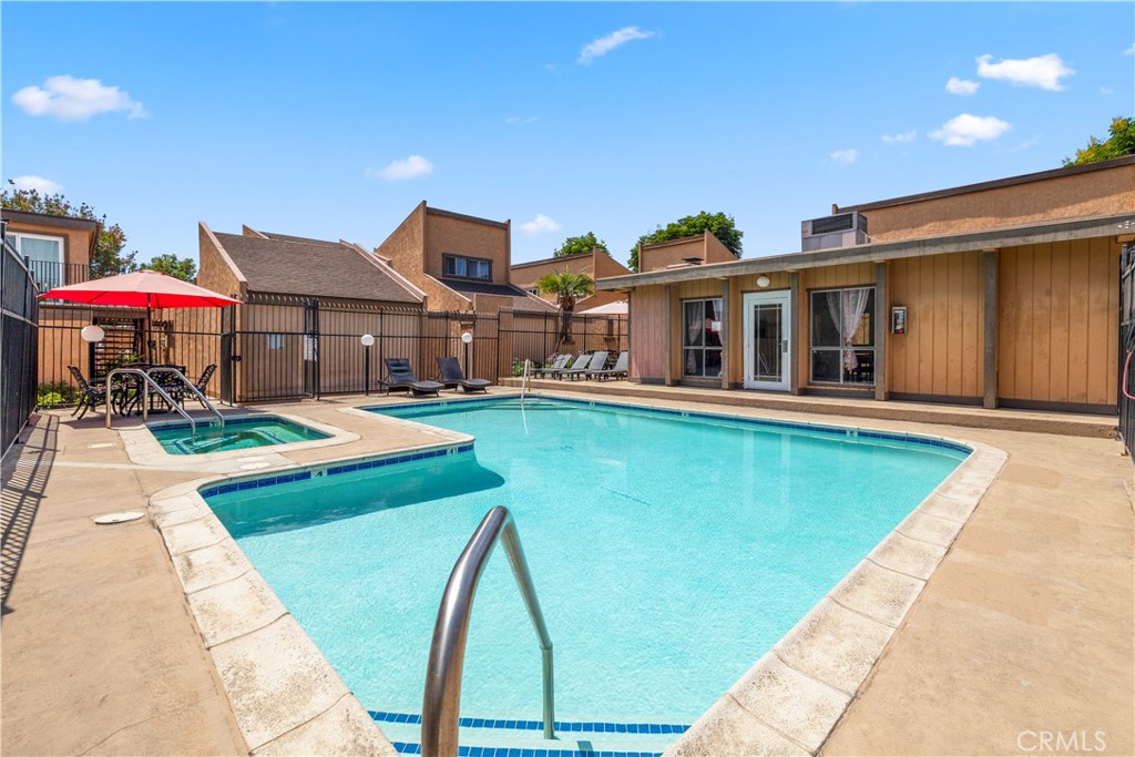 2700 North Brea Boulevard, Unit 24 Fullerton, CA 92835 - Photo 25 of 27 a front view of a house with swimming pool and porch