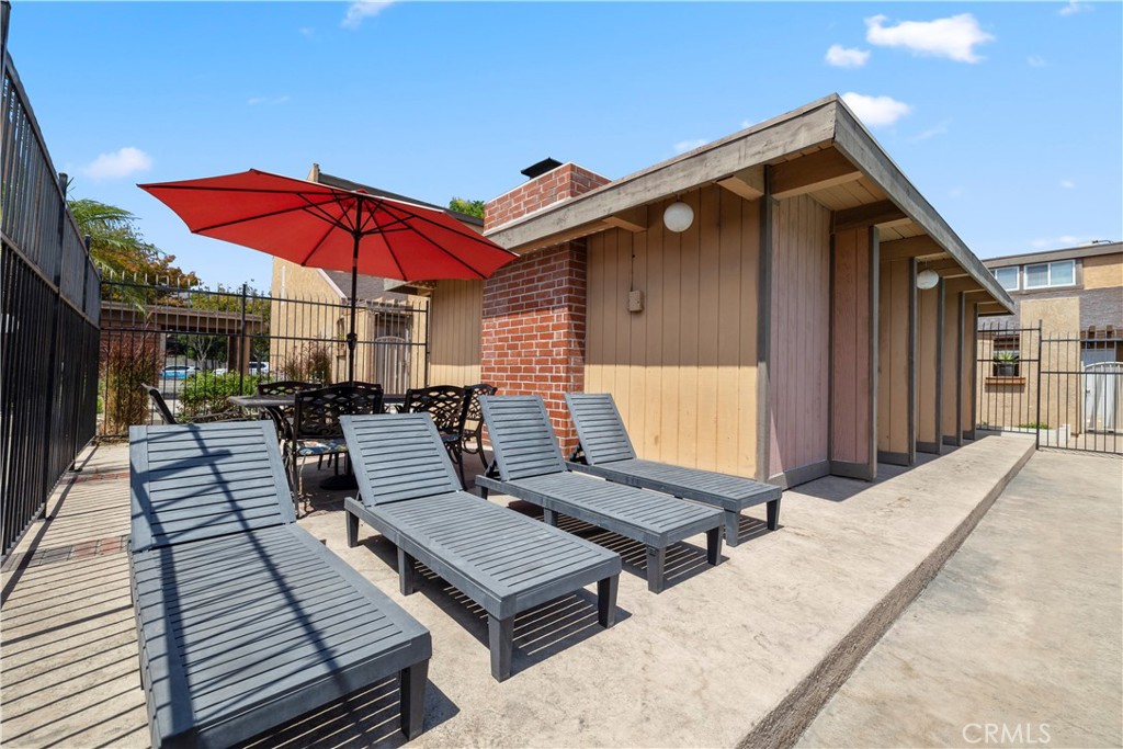 2700 North Brea Boulevard, Unit 24 Fullerton, CA 92835 - Photo 27 of 27 deck with patio table and chairs