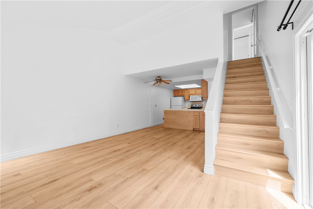 2700 North Brea Boulevard, Unit 24 Fullerton, CA 92835 - Photo 6 of 27 a view of entryway and hall with wooden floor