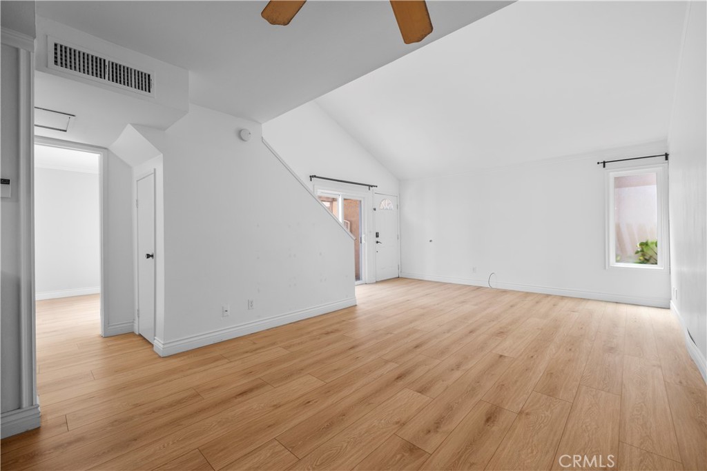 2700 North Brea Boulevard, Unit 24 Fullerton, CA 92835 - Photo 8 of 27 a view of empty room with wooden floor
