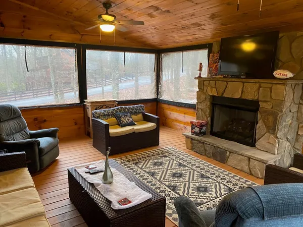 a living room with furniture and a fireplace