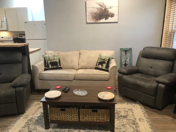 a living room with furniture and a couch