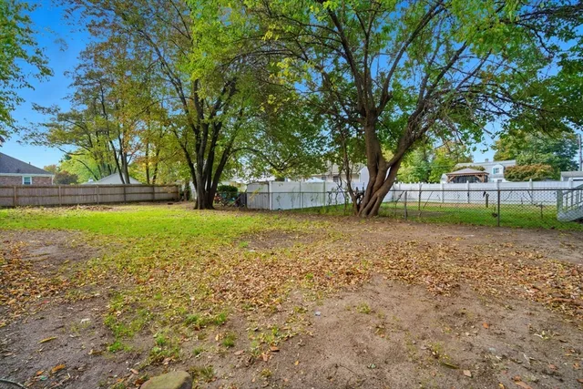 a view of outdoor space with deck and green space