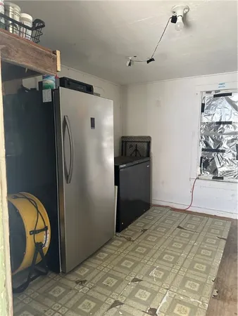 a view of a storage & utility room with closet
