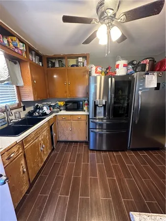 a kitchen with granite countertop a stove and cabinets