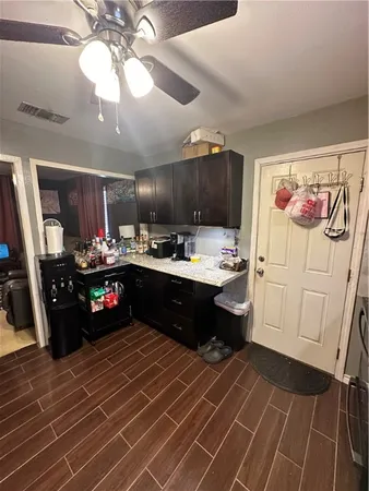 a kitchen with a refrigerator and a sink