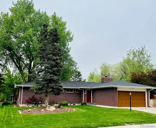 a front view of house with yard and outdoor seating